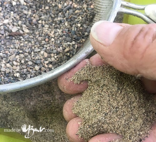 sand being sieved to get finer sand