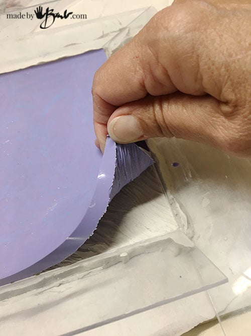 Pulling mold off sculpture